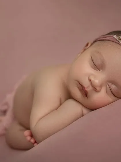 A close up side view, capturing the baby's delicate eyelashes and lips. These simple, posed shots are perfect for highlighting all the tiny details.