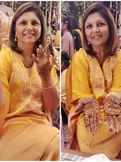 A happy guest at a wedding, showing off her simple and elegant party mehndi. I am available to do henna for all the guests at your event.