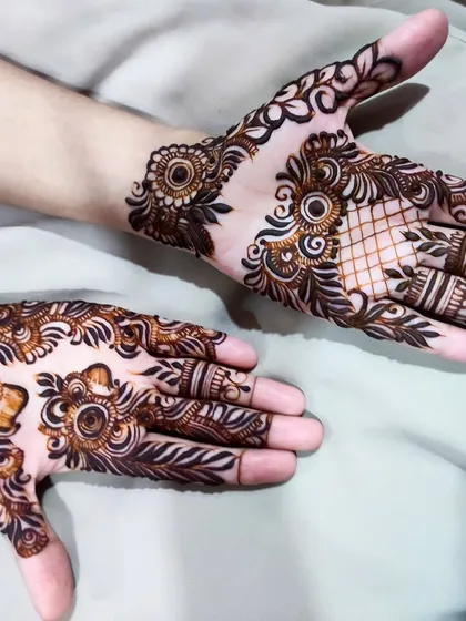 A lovely design combining a leafy net pattern with a bold cuff, showing how to mix different textures.