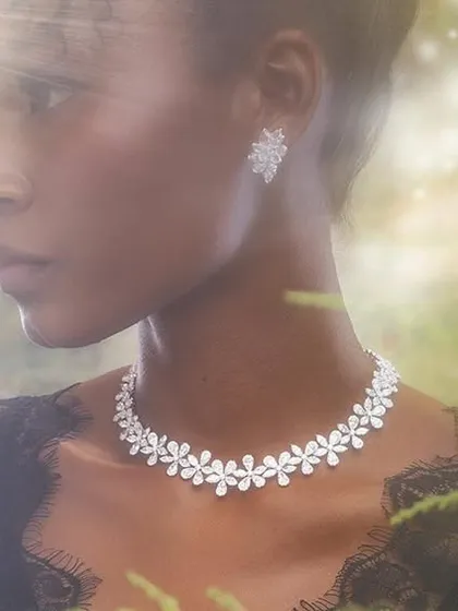 An ethereal shot for a luxury jewellery campaign. We created a magical, forest-like atmosphere with soft, diffused light to make the diamond necklace and earrings stand out beautifully.