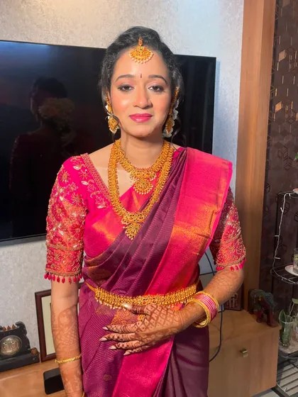 A full-length shot of Shraddha's engagement look. The makeup is balanced to look beautiful both up close and from a distance, ensuring she looks perfect in every photo.