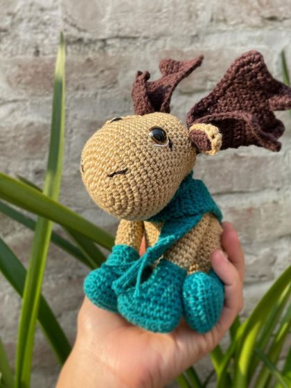 This is Durward the Moose, a character I made as part of a crochet-along. I love his big antlers and the cozy teal scarf he's wearing.