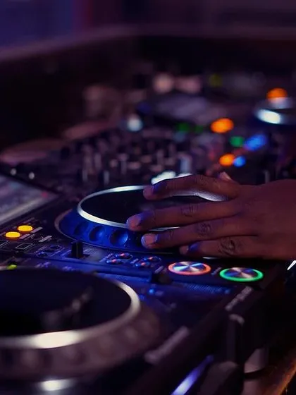 Getting hands-on with a Pioneer CDJ. In my studio, you'll learn scratching and mixing techniques on the same professional equipment used in top clubs worldwide, ensuring you're prepared for real gigs.