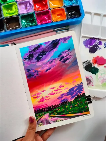 The finished melodious sunset painting in my sketchbook. The vibrant colors and expressive clouds make this a personal favorite.
