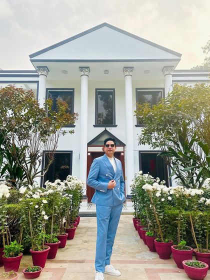 Posing in front of the magnificent venue for a Mehendi. The setting always inspires the music.