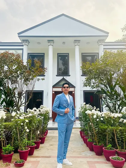 Posing in front of the magnificent venue for a Mehendi. The setting always inspires the music.