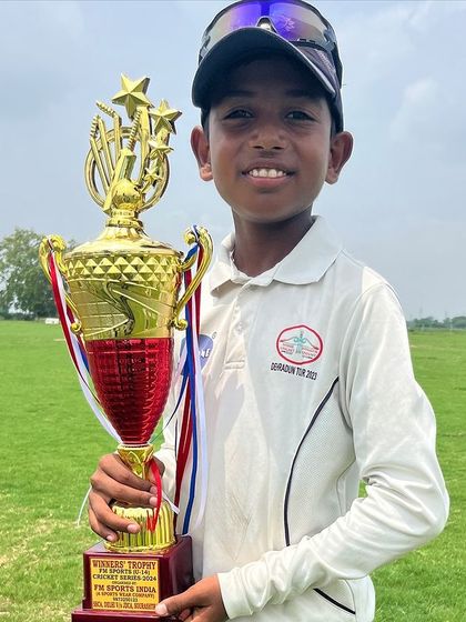 A close-up of one of our young champions with his well-earned trophy.