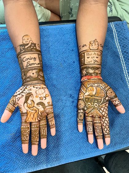 The full view of the 'Coming Soon' baby shower mehendi, showcasing all the custom elements.