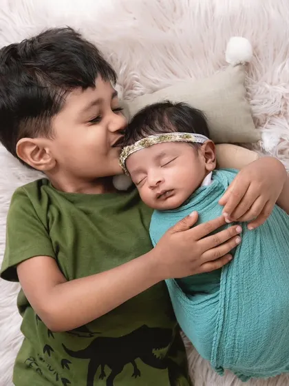 There's nothing sweeter than the bond between siblings. Capturing an older brother's gentle affection for his new baby sister is one of my favorite things. These are the quiet, tender moments that you'll look back on for years to come.
