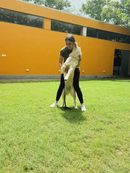 A joyful reunion hug with Pixel in our sunny yard.