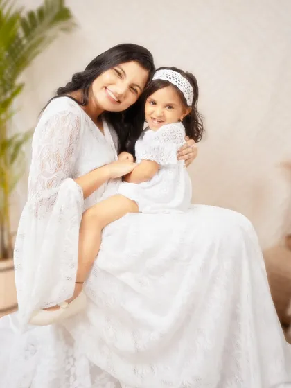 A bright and airy portrait of a mother and daughter sharing a happy moment. Dressed in coordinating white lace, their genuine smiles and easy embrace radiate pure love and connection. This is the kind of simple, beautiful memory I love to preserve.