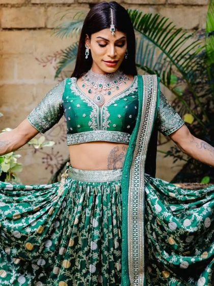A playful pose showing the flow of the lehenga and the sparkle of our rental jewellery.