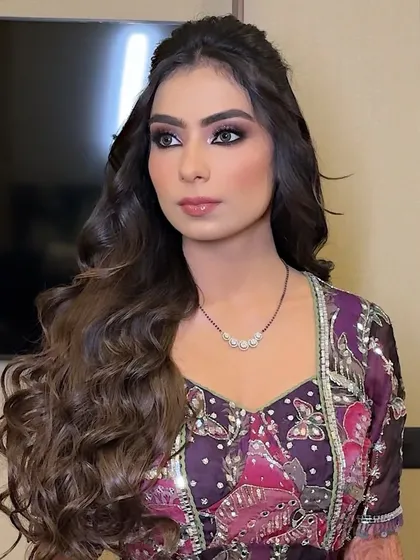 A side profile showcasing the beautifully blended purple smokey eye. The colors are vibrant yet seamlessly integrated for a polished finish.