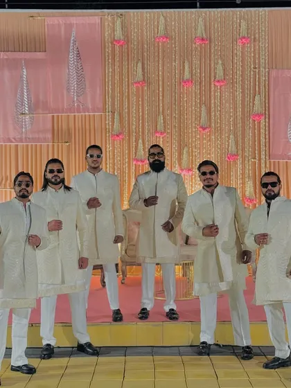 Ready for a baraat in Jaipur. Our coordinated off-white outfits add a touch of class and unity to our performance.