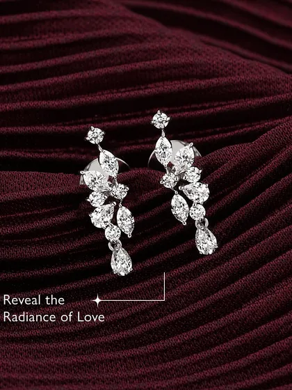 Reveal the radiance of love. Adorn yourself with my customizable diamond leaf earrings, where elegance meets a personal touch. The cascading design is tailored to your unique style, because love deserves nothing less than brilliance.