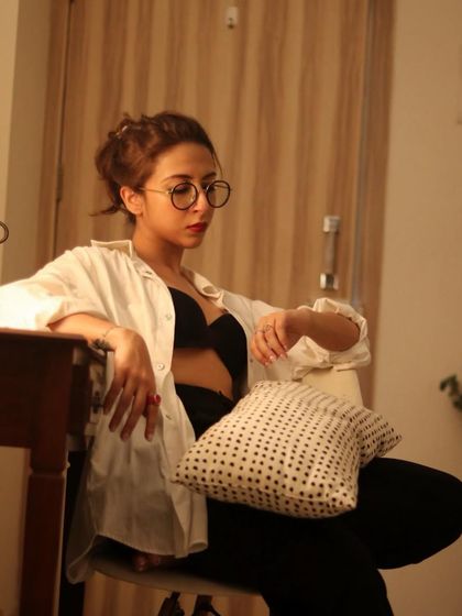 A moody, relaxed shot at home. Sometimes the best look is an oversized white shirt, comfy trousers, and my favourite glasses.