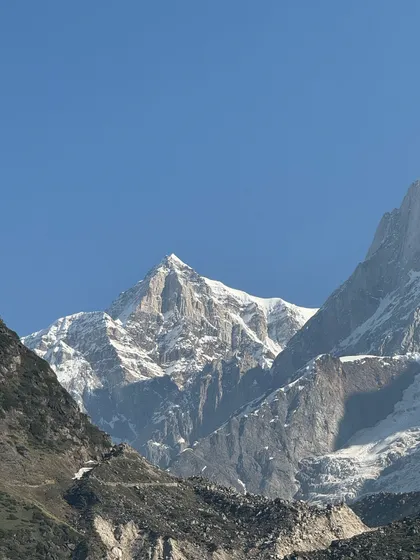 A breathtaking view of the snow-capped Himalayan peaks. This is the raw, unfiltered beauty that awaits you on our treks, a powerful reminder of nature's grandeur and the reason we feel the pull of the mountains.