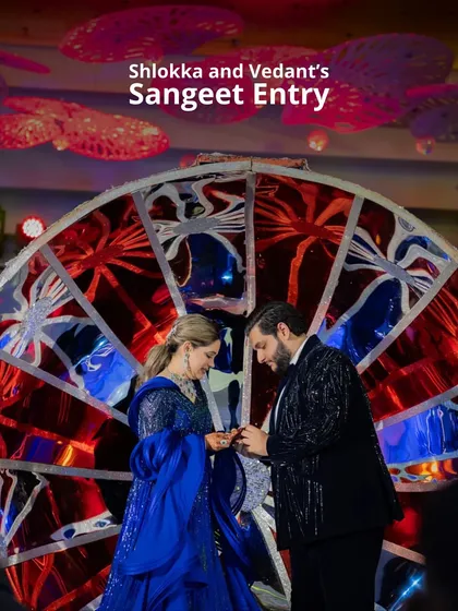 Shlokka and Vedant's Sangeet entry was a moment of pure artistry. They exchanged rings in front of a magnificent, custom-made stained-glass-effect wheel, creating a vibrant and unique photo opportunity.