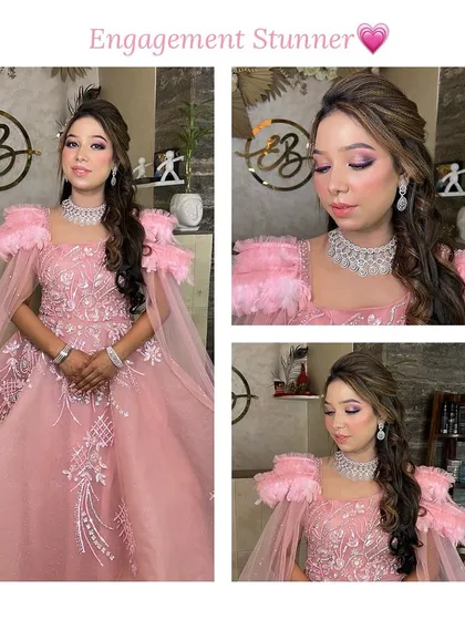 This engagement look is all about fairytale glamour. The client is wearing a stunning pink gown with feather details, which we complemented with sparkling eye makeup and flowing curls.