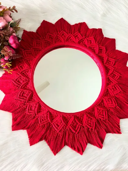 The vibrant red of this mirror mandala really pops. It's a perfect statement piece for anyone who loves bold colors and boho style.