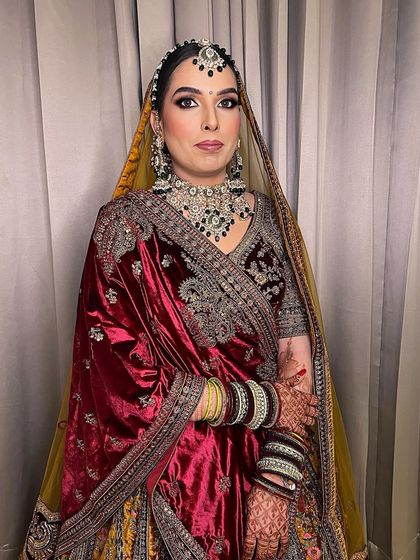 A full view of this sweet bride in her bridal glory. The makeup is designed to be both elegant and long-lasting, perfect for a winter wedding.