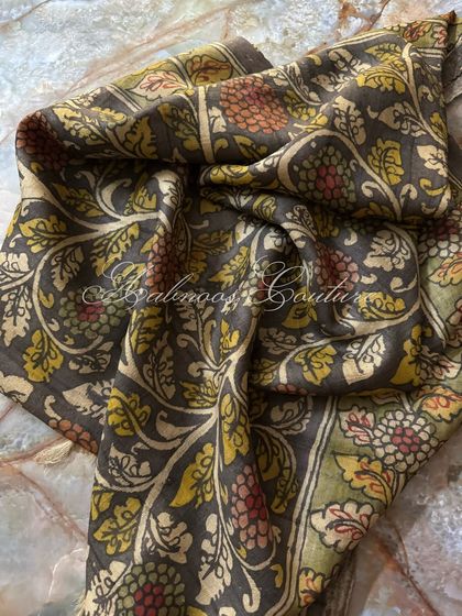 This shot captures the soft sheen of the silk and the meticulous detail of the hand-painted vines and flowers, a testament to the artisan's skill.