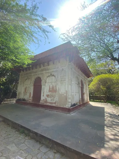 A beautiful Mughal pavilion in Sunder Nursery, showcasing the distinctive sloping roof and decorative plasterwork of the period.