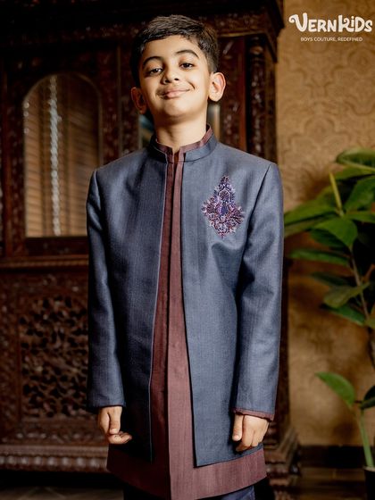 The full look of our layered Indo-western set. The combination of the structured jacket over the flowing kurta creates a balanced and sophisticated silhouette for any young gentleman.
