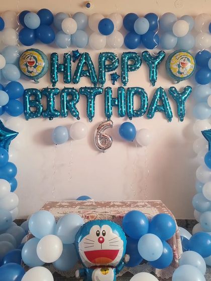 A classic Doraemon themed birthday decoration in shades of blue and white.