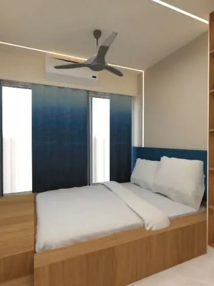 The design includes an elevated bed and an integrated study desk, making the most of a small footprint.