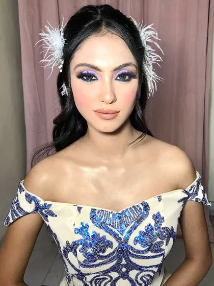 Another angle of the look, showing the placement of the feather hair clips.