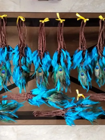 A closer look at the feather headbands we created for a bulk order. These are perfect as party favors or for coordinating a group look at a themed event.