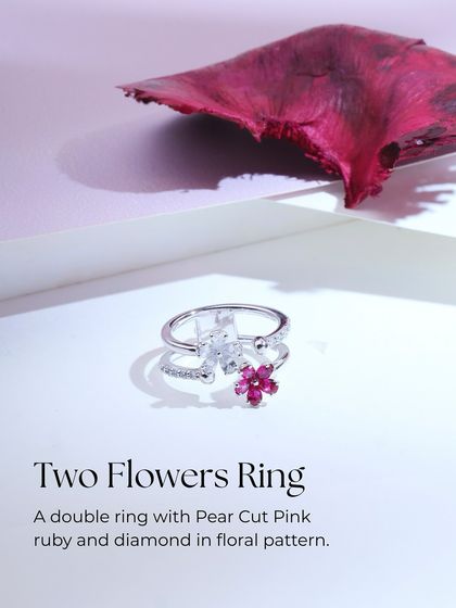 A labeled product shot of the "Two Flowers Ring," detailing its unique double-ring structure and floral pattern of pear-cut pink ruby and diamond.