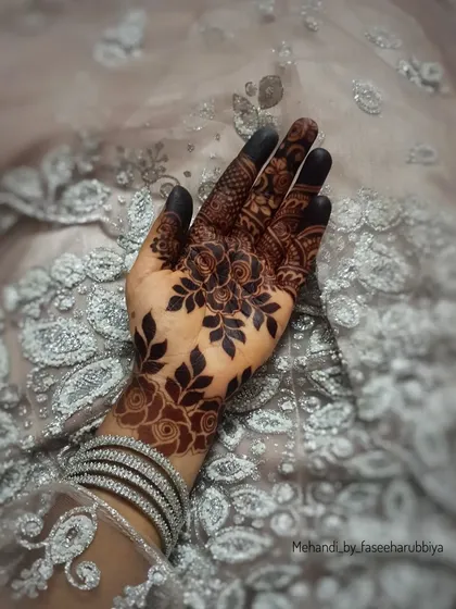 The same dark stain, accessorized with silver bangles, showing how henna can be a beautiful part of any look.