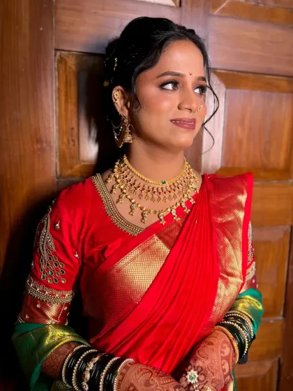 My beautiful bride Poonam, looking elegant in her red and green saree for her engagement ceremony.