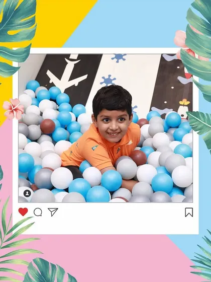 A candid moment of pure happiness. Our ball pit is a colorful paradise where kids can just be kids.