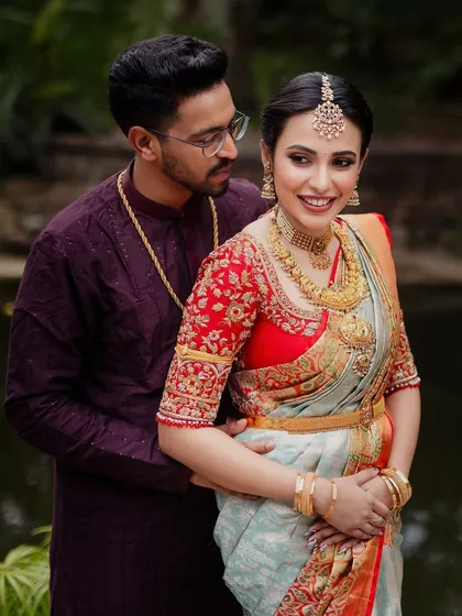 A romantic portrait of the bride and groom. Their coordinated outfits and my makeup and styling create a harmonious and beautiful picture.