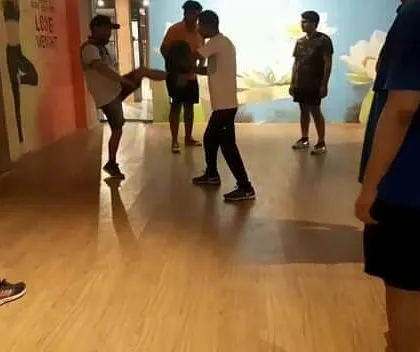 Another angle of our group kickboxing drills. Repetition is the mother of skill, and we ensure every student masters the fundamentals.