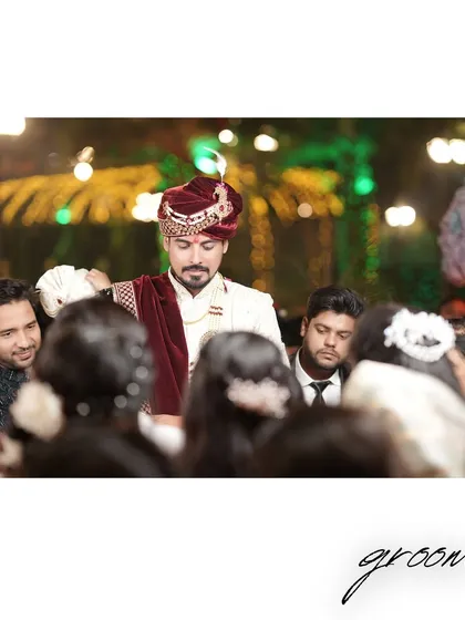 A classic portrait of the groom, looking dapper and ready for the ceremony.