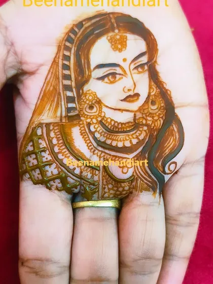A close-up of a bridal portrait on the palm. I focus on getting the eyes and expressions just right to make the portrait feel alive.