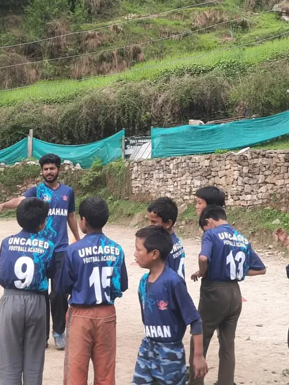 A proud moment for the team. Here I am explaining a drill to the kids, all wearing their new Uncaged Football Academy jerseys for the first time. Having a team kit brings a real sense of identity and belonging.