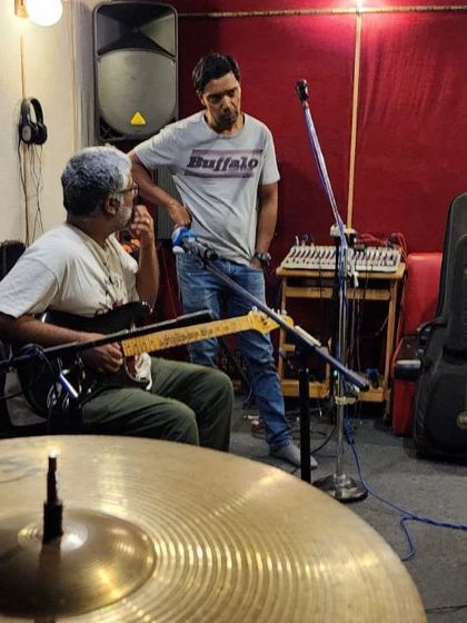Another shot from our "Full Meals down by the Wayside" jam session. The focus is intense when we're locking in a groove.