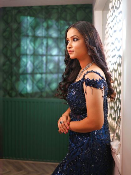 Another beautiful portrait by the window, showcasing the makeup in natural light.