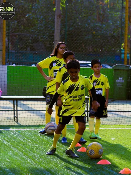 Players line up to practice their dribbling, learning from each other as they go.