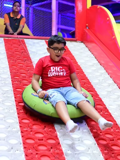 The donut slide is always a huge hit. It’s perfect for racing, laughing, and getting that little rush of speed. This shot captures a moment of pure, simple fun that kids come back for again and again.