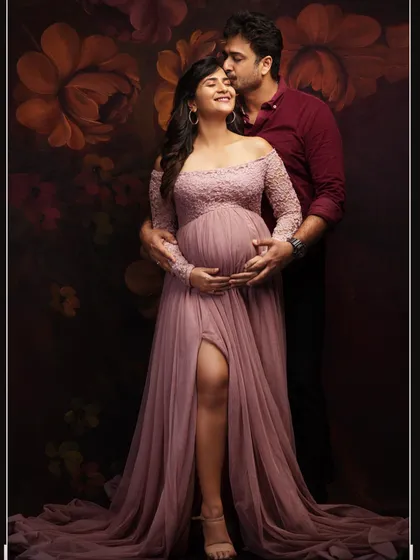 Pure love and anticipation. This intimate couple's portrait, set against a beautiful floral backdrop, captures the tender moments before two become three. It’s these quiet, shared glances that tell your unique love story.