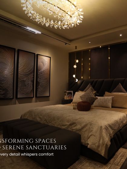 This bedroom is a serene sanctuary. The dark, dramatic walls are balanced by soft, ambient lighting and luxurious bedding, creating a space that feels both cozy and opulent.