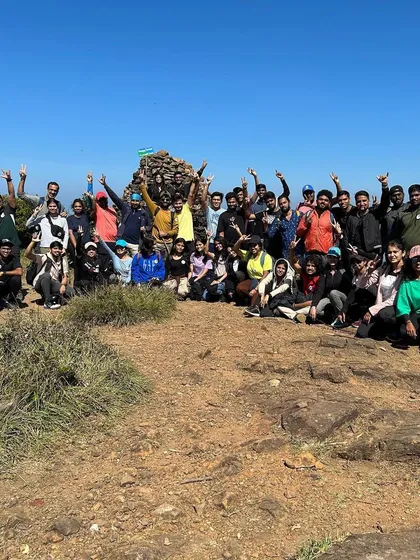 A large group celebrating at the Kumara Parvatha summit, a great start to the year.