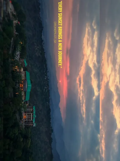 A serene sunset view over a hillside resort. This shot captures the peaceful and romantic atmosphere of a mountain destination wedding.