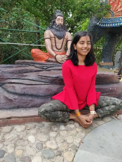 Finding a moment of peace in Baddha Konasana. Even among the playful poses, there is always a return to stillness.